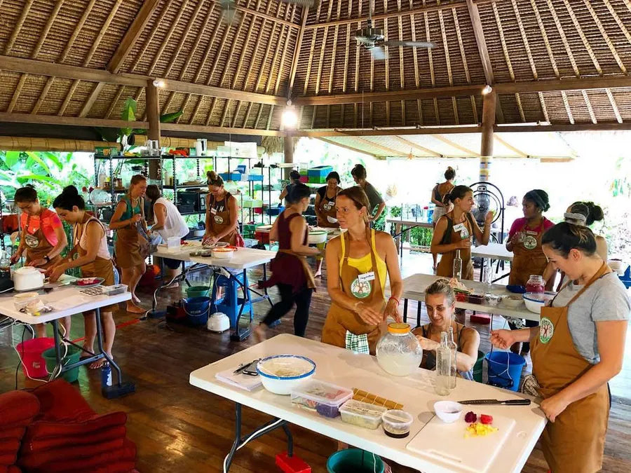 Students learning together in the open-air Bali training kitchen