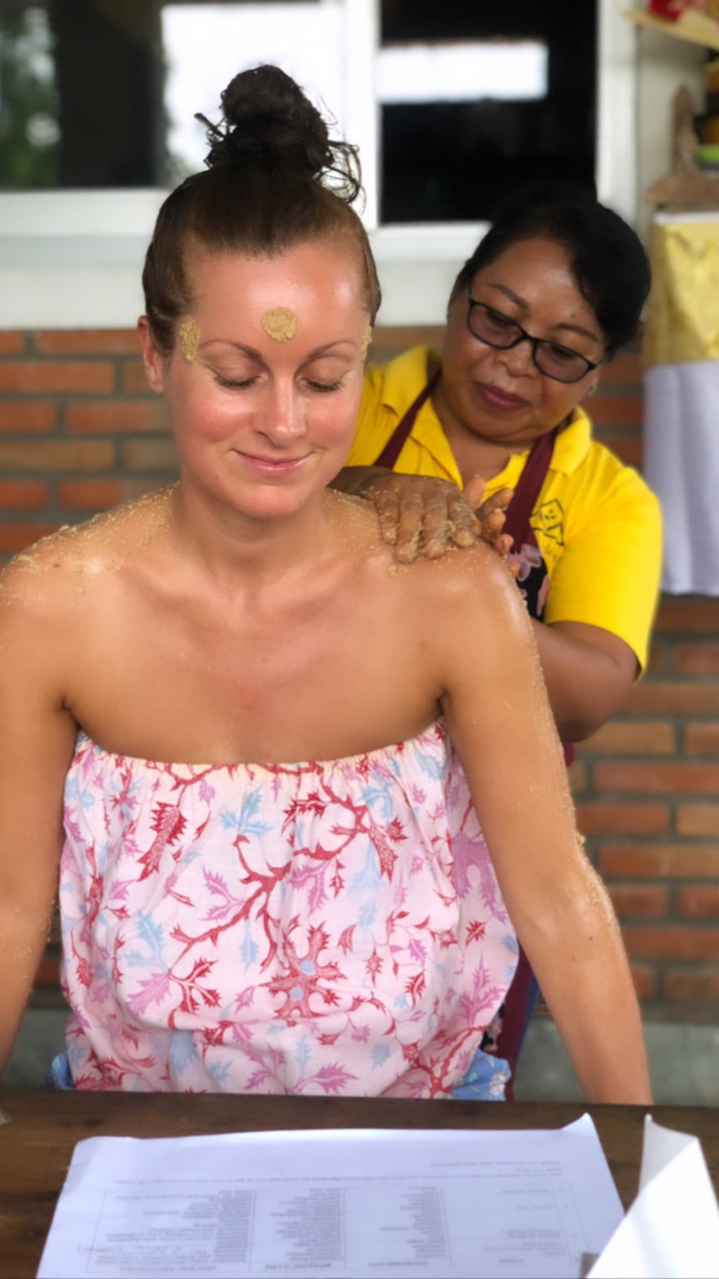 A Seeds of Life student enjoying a traditional herbal massage during the Nadis Herbals workshop